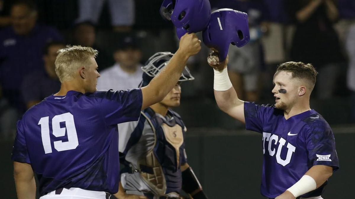 TCU’s Luken Baker, left, congratulates Evan Skoug after Skoug’s first-inning home run Tuesday night against Rice.