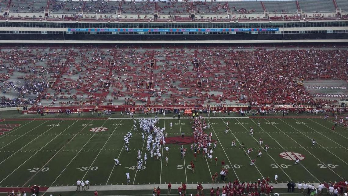 TCU and Arkansas players warm up before kickoff.