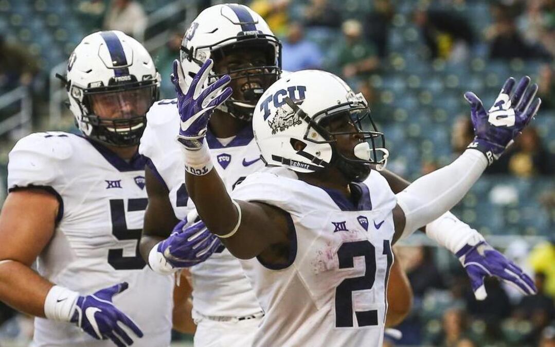 TCU Horned Frogs running back Kyle Hicks (21) celebrates his fifth touchdown against Baylor at McLane Stadium in Waco, Texas, Saturday, November 5, 2016.