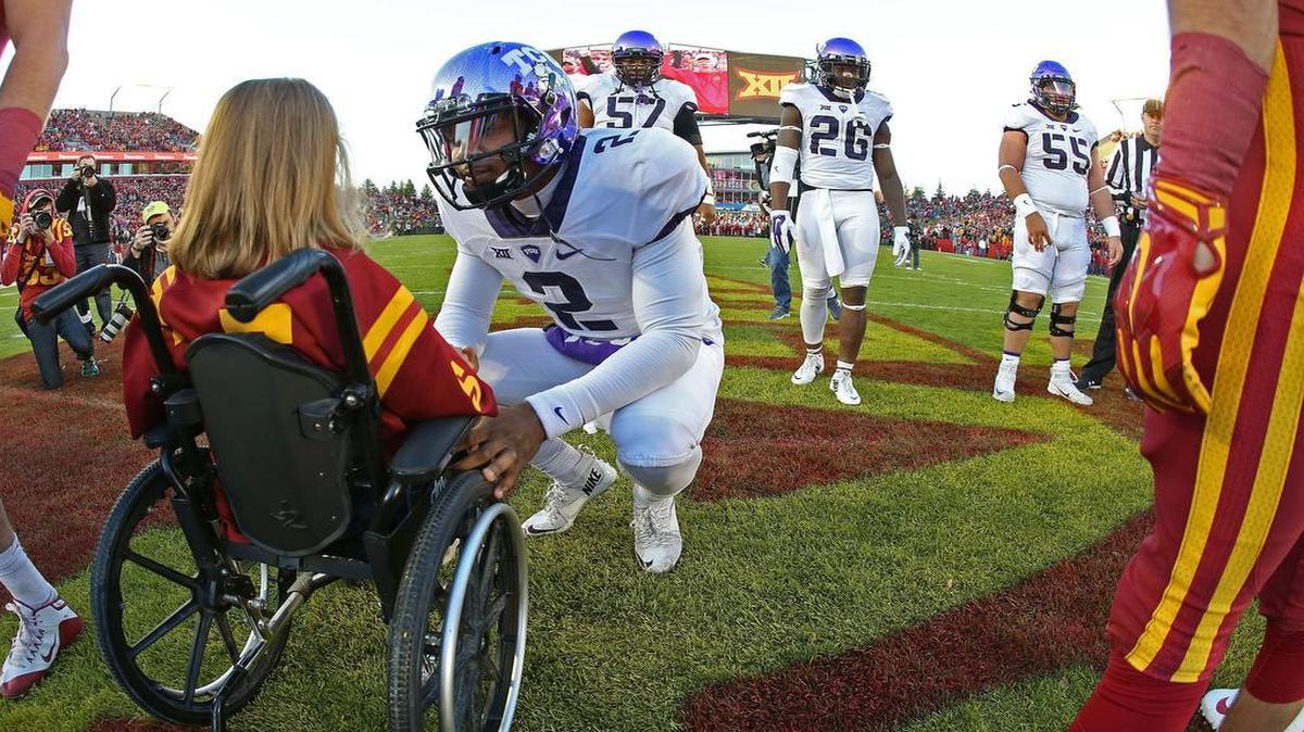 TCU quarterback Trevone Boykin’s behavior sparked an outpouring of interest in this Paul Moseley photograph of Boykin meeting 7-year-old Iowa State fan Abby Faber before the coin toss of an Oct. 17 game at Ames, Iowa.