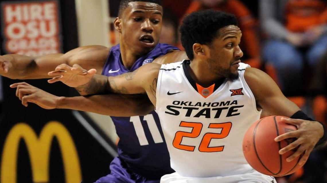 Oklahoma State’s Jeff Newberry, right, scored a game-high 23 points agianst Brandon Parrish and TCU in a Big 12 game Saturday.