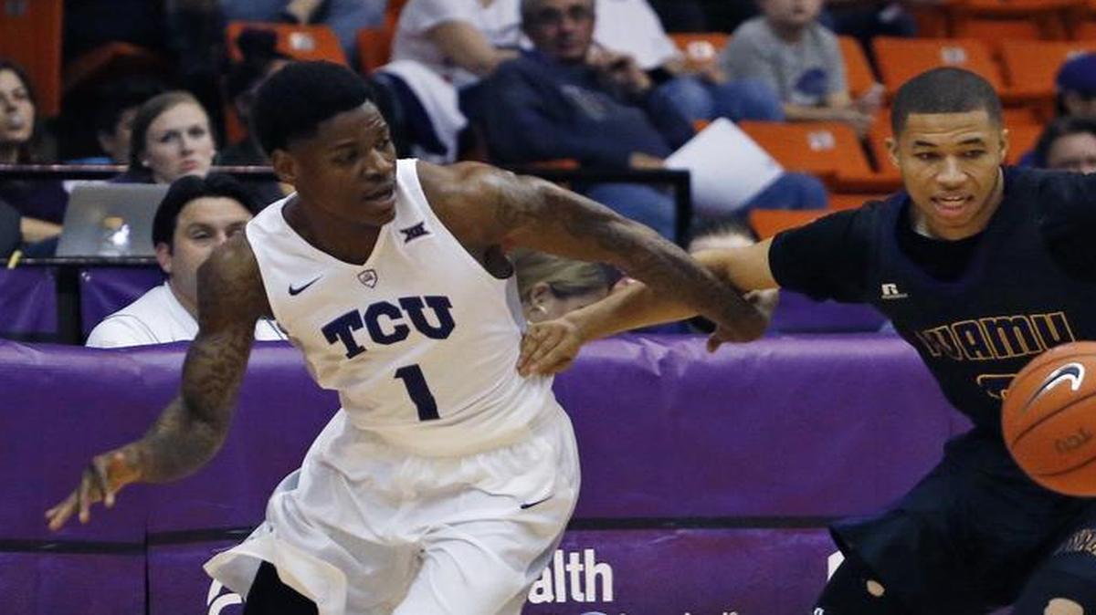 TCU guard Chauncey Collins, left, and Prairie View A&M’s Jordan Giddings scramble for a loose ball in the first half.