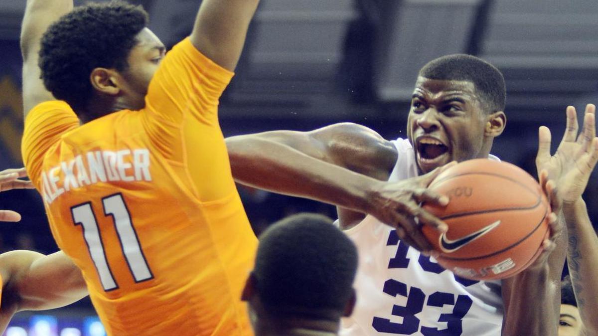 TCU forward Chris Washburn drives for a shot against the defense of Tennessee’s Kyle Alexander and Amani Moore during first-half action Saturday at Schollmaier Arena. Washburn finished with 14 points, three steals and a career-high five assists in the Horned Frogs’ 75-63 victory.