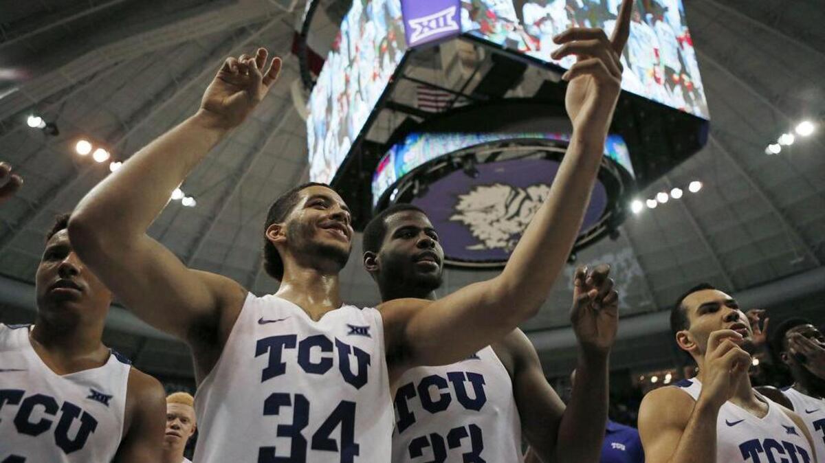 TCU guard Kenrich Williams (34), who had a triple-double in Tuesday’s victory over Richmond, celebrates with teammates after the Horned Frogs sealed a berth in next week’s NIT semifinals in New York.