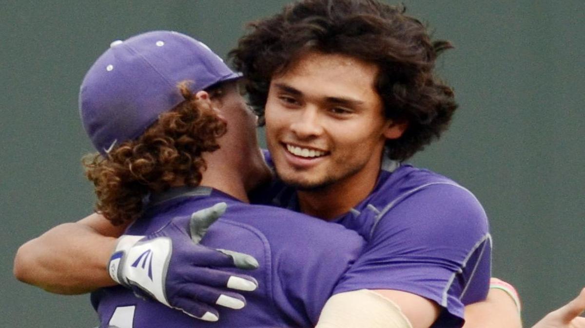 
Elliott Barzilli and Cody Jones embrace after an error on a ball off Barzilli’s bat allowed the winning run to score in the 10th inning against Kansas on Saturday. The Frogs are 26-2 at home this year and 2-2 in extra innings overall.
