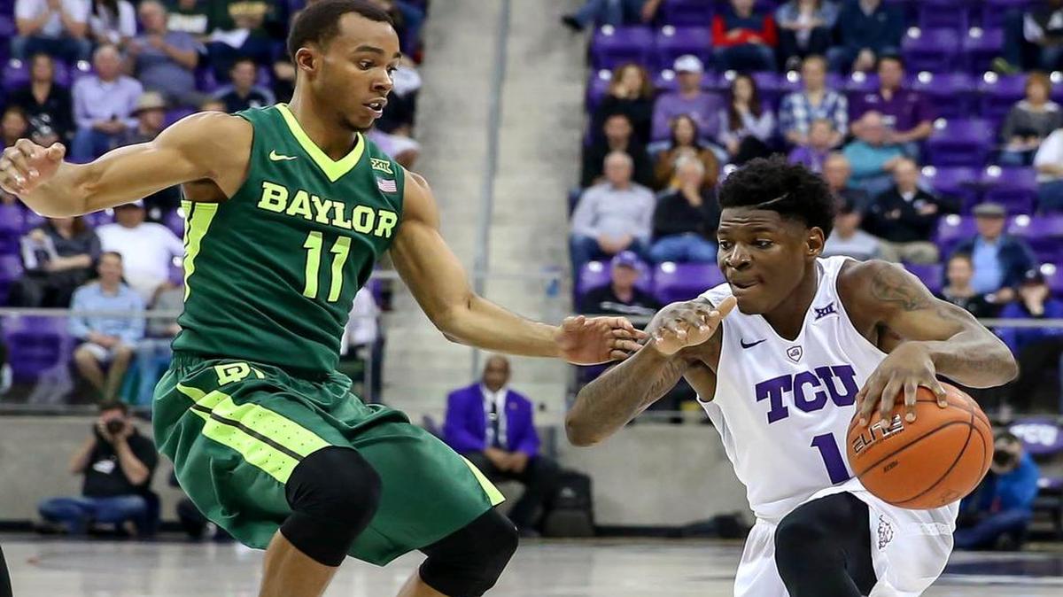 TCU guard Chauncey Collins (1) tries to get past Baylor guard Lester Medford (11) during the first half.