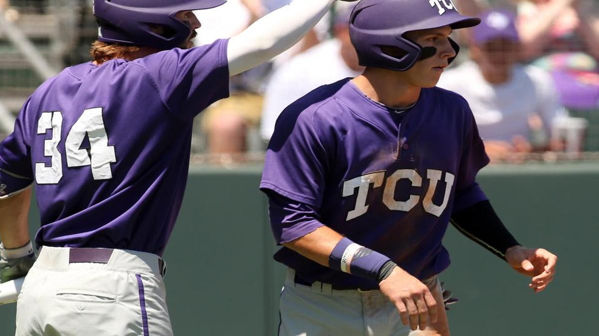 
Nolan Brown gets a tap on the helmet from Garrett Crain after scoring in the second inning of TCU’s game against Stony Brook on Sunday. Brown had three hits, including two doubles, in the Horned Frogs’ 8-3 victory, setting up a rematch with N.C. State on Sunday night.
