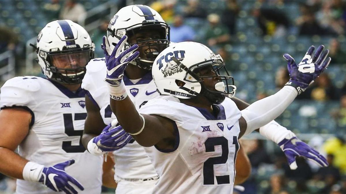 TCU running back Kyle Hicks, left, rushed for 192 yards and -high five touchdowns, both career highs, on Saturday in a 62-22 victory over No. 17 Baylor.