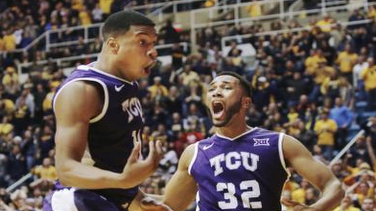 
TCU forward Brandon Parrish (11) and guard Trey Zeigler (32) are shocked by a foul called in favor of West Virginia in the final moments of overtime of an NCAA college basketball game, Saturday, Jan. 24, 2015, in Morgantown, W.Va. West Virginia defeated TCU 86-85 in overtime. 
