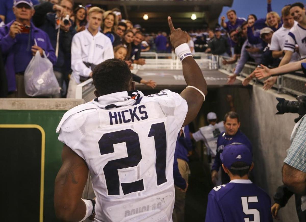 TCU running back Kyle Hicks salutes fans as he leaves the field after the Horned Frogs’ 62-22 win over Baylor at McLane Stadium in Waco on Nov. 5, 2016. Hicks rushed for a career-high 192 yards and five touchdowns.
