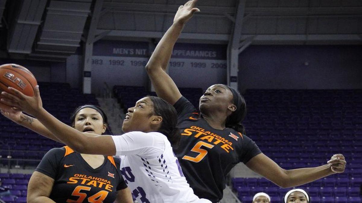 TCU guard AJ Alix, driving around Oklahoma State’s Kaylee Jensen, left, and Diana Omozee, scored a season-high 24 points.