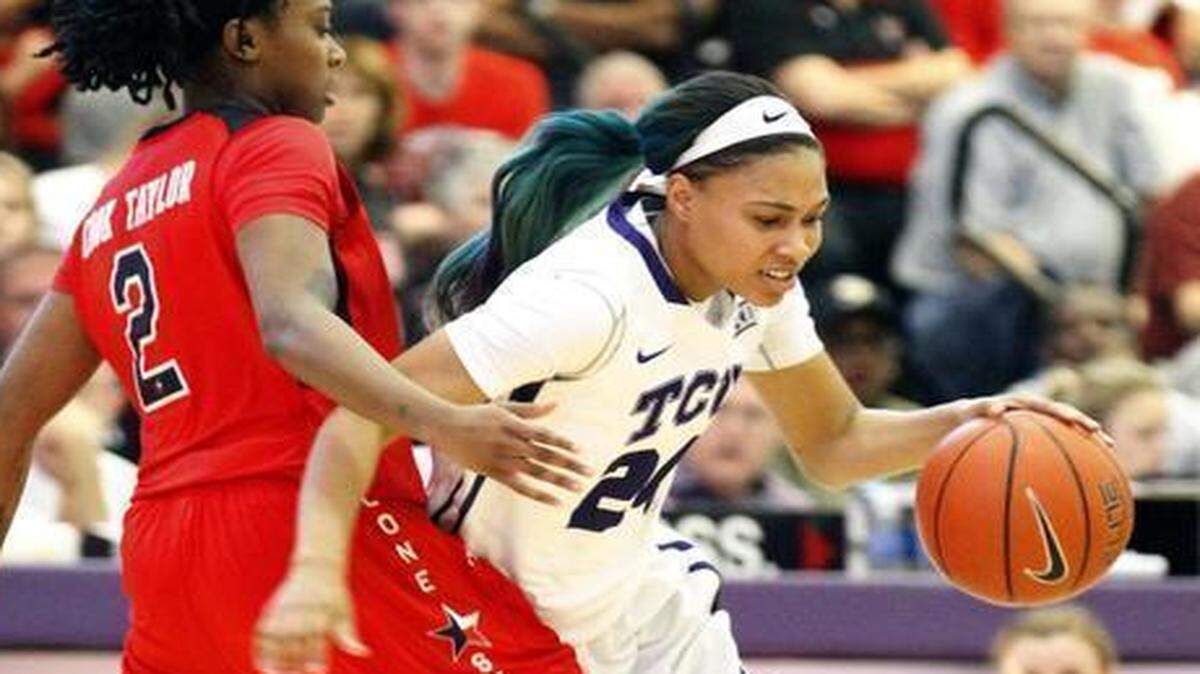 
TCU guard Natalie Ventressm right, drives around Texas Tech’s Ivonne CookTaylor at the University Recreation Center. Ventress led the Horned Frogs with 11 points Sunday. 
