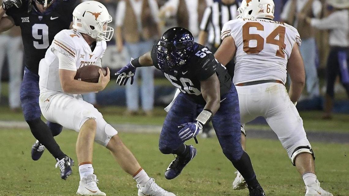 TCU defensive tackle Chris Bradley closes in on Texas quarterback Shane Buechele for one of seven sacks by the Horned Frogs in Saturday night’s game.
