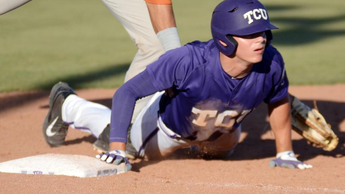 
TCU designated hitter Connor Wanhanen makes it back into first base ahead of a pickoff attempt in the Texas series two weekends ago. The Horned Frogs’ sweep of that series, and their sweep of the West Virginia series on Sunday, put them in first place in the Big 12.
