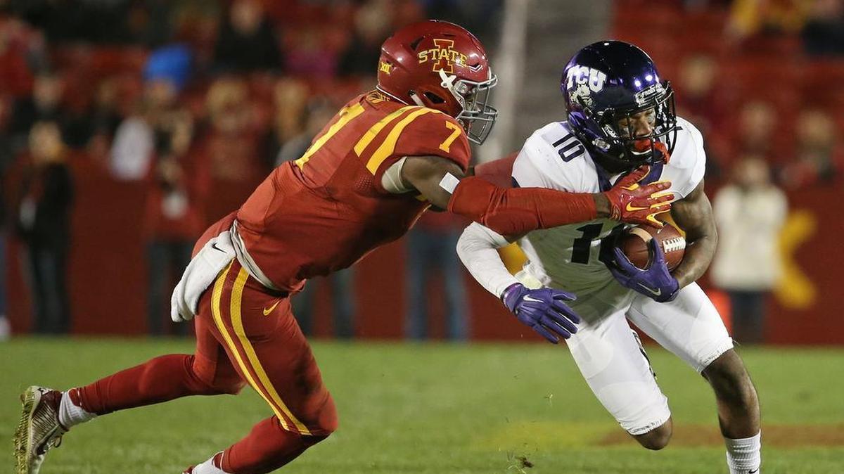 TCU receiver Desmon White turns upfield against Iowa State defensive end Seth Nerness in a 2015 game at Jack Trice Stadium in Ames, Iowa.