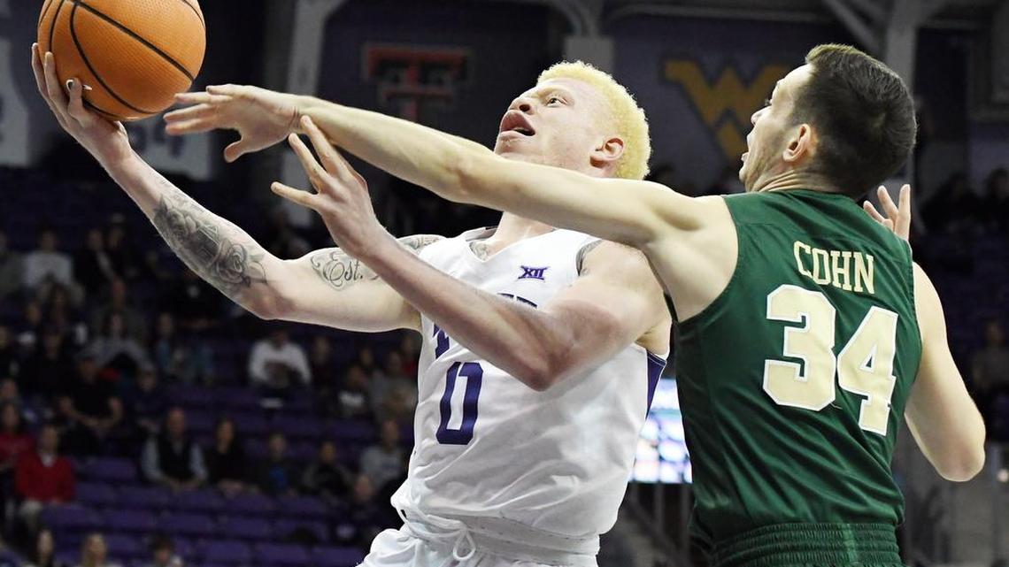 Jaylen Fisher, left goes up for the basket and draws the foel from William and Mary's David Cohn in the first half of Friday's December 22, 2017 basketball game at Scholimaier Arena in Fort Worth, Texas. Special/Bob Haynes