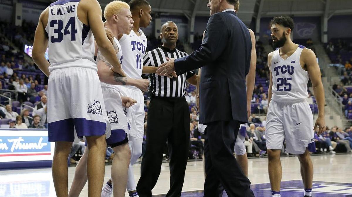 TCU men’s basketball coach Jamie Dixon talks with players during Wednesday’s game against Kansas State. Dixon and the Horned Frogs received a commitment Friday from 6-foot-9 forward Andre Rafus from Baltimore, Md.