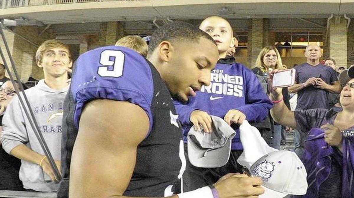 TCU receiver Josh Doctson signs autographs after the Horned Frogs’ game against West Virginia on Oct. 29. He caught two touchdown passes in the 40-10 victory, his sixth straight game with two touchdown catches or more.