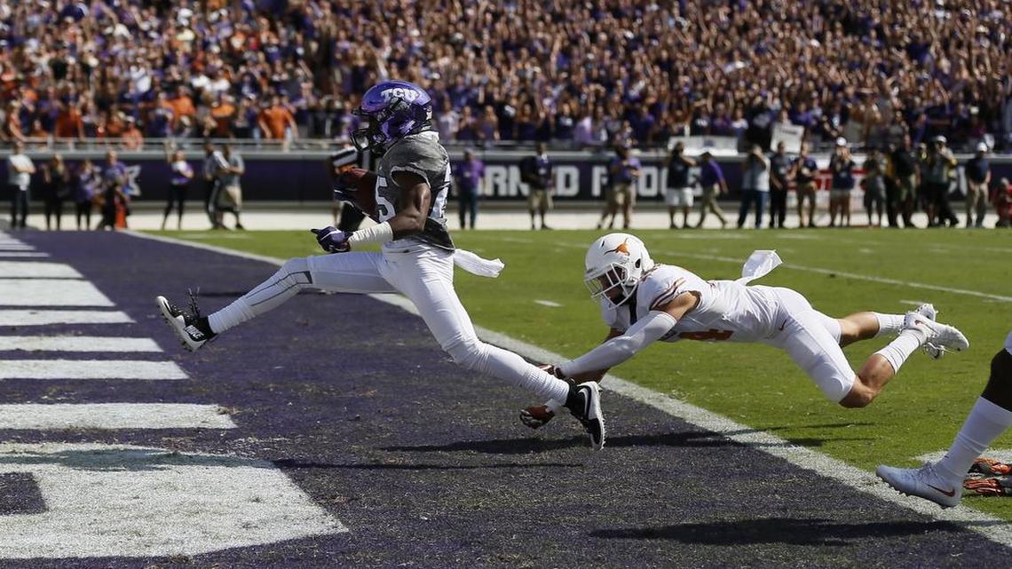 
Texas junior safety Dylan Haines is unable to stop TCU freshman wide receiver KaVontae Turpin from scoring a touchdown.
