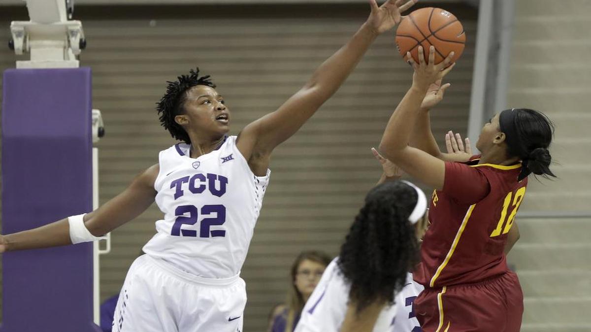 TCU center Jordan Moore, left, blocking a shot against Iowa State earlier this season, had 12 points and 11 rebounds Friday as the Frogs lost to Texas Tech in the first round of the Big 12 women’s basketball championship in Oklahoma City.