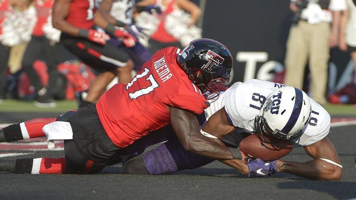 
TCU receiver Emmanuel Porter goes to the ground with a potential touchdown catch last week against Texas Tech’s Thierry Nguema. The pass was ruled incomplete, however. Porter finished with one catch for 11 yards.
