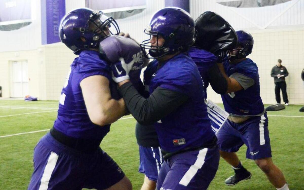 TCU center Austin Schlottman (right) goes through a drill with tackle Trey Elliott during spring practice in March 2015. Schlottman begins 2016 as the full-time starter. Elliott will miss the season because of injury.