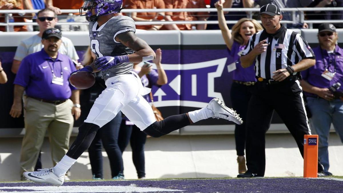 
TCU receiver Josh Doctson crosses the end zone with a touchdown catch off a throw from Shaun Nixon. For Doctson, it was his school-record 23rd career touchdown catch, breaking Josh Boyce’s record.
