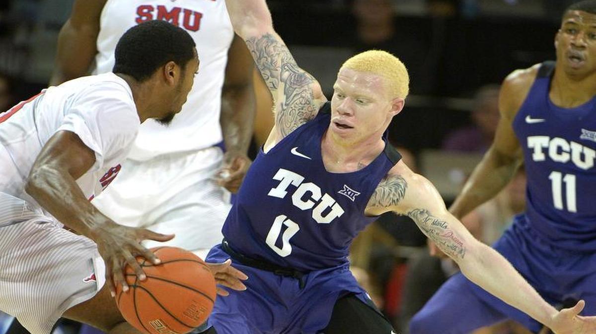 TCU freshman guard Jaylen Fisher tries to distract and defend SMU guard Sterling Brown during Wednesday’s game.