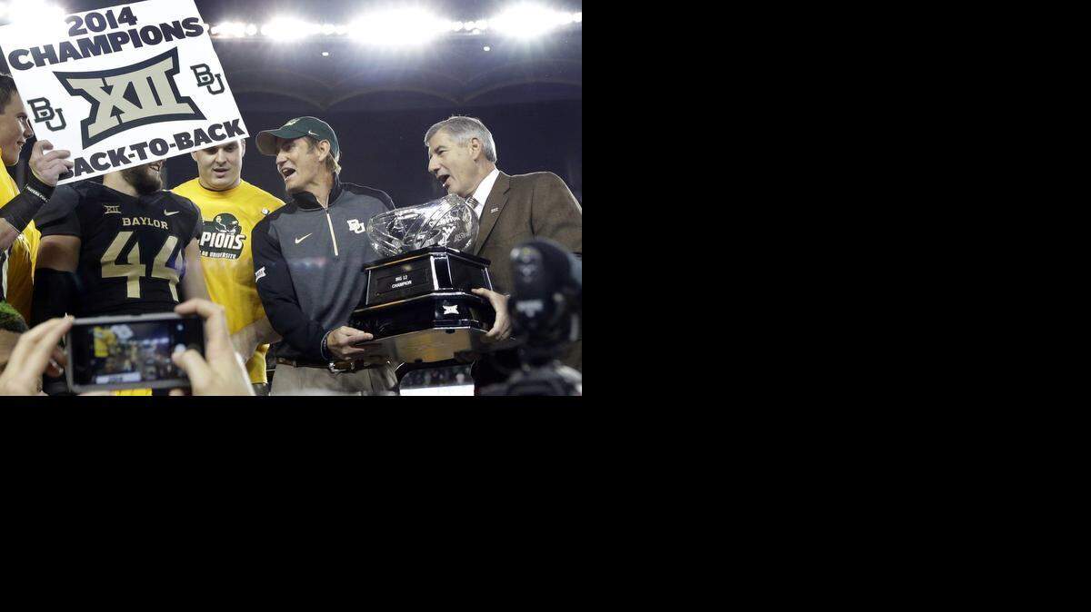 
Big 12 Commissioner Bob Bowlsby, right, said he would have chosen TCU over Baylor for a spot in the four-team bracket if he had been part of the 12-member selection committee. (AP Photo/Tony Gutierrez)
