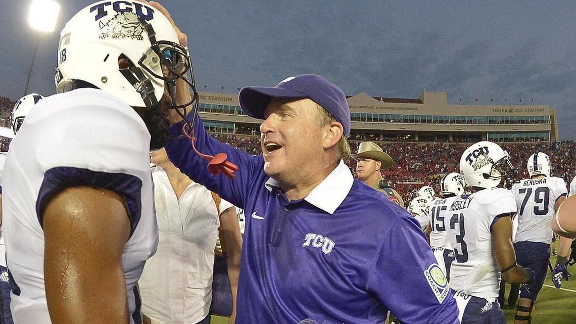 TCU coach Gary Patterson celebrates with safety Nick Orr following a 55-52 victory against Texas Tech at Jones AT&T Stadium in Lubbock on Sept. 26, 2015.