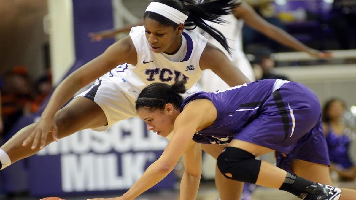 TCU guard Jada Butts, left, scrambles for a loose ball against Stephen F. Austin’s Taylor Ross during their game Dec. 4, 2013. The teams meet Wednesday at the University Rec Center.