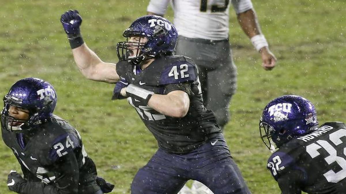 TCU linebacker Ty Summers (center) reacts after making a tackle to stop a fourth-and-1 play in the second overtime against Baylor on Nov. 27. The play, one of 23 tackles for Summers, won the game for the Horned Frogs and sent them to the Alamo Bowl.