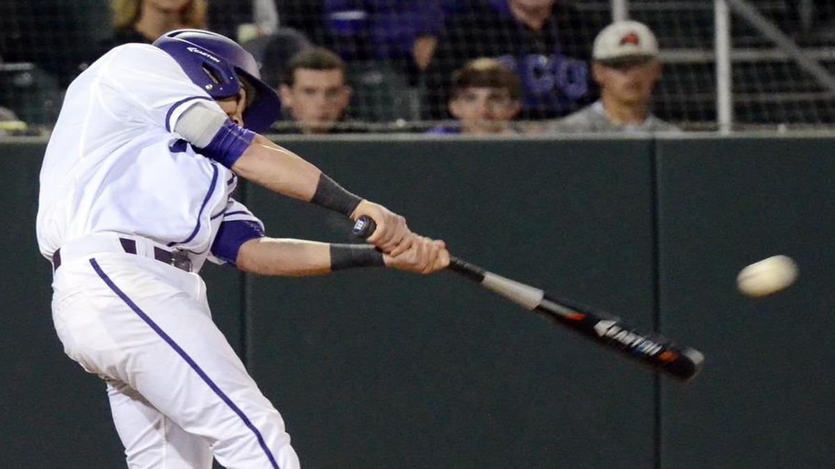 TCU’s Ryan Merrill hits a two-out triple in the ninth inning against Gonzaga.