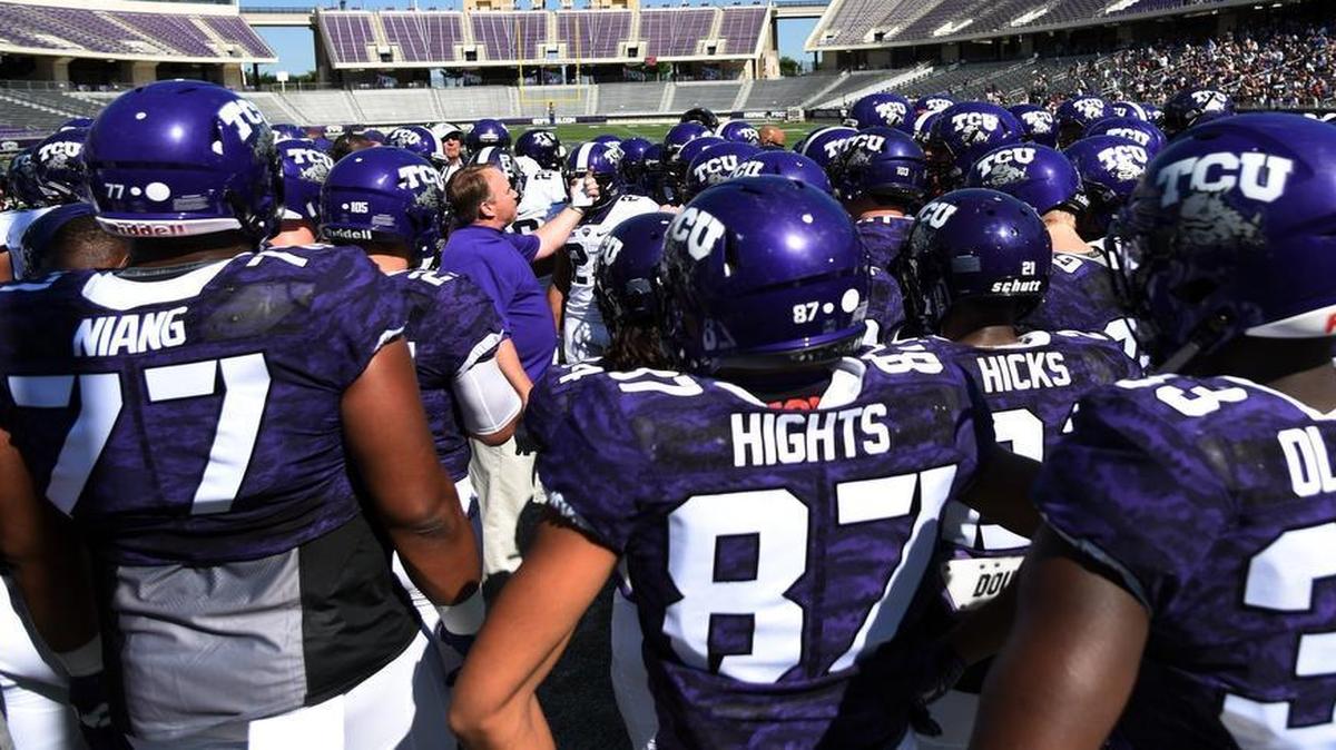 TCU head football coach Gary Patterson is surrounded by his team as he gives instructions before the start of the TCU spring football game Saturday April 8, 2017 at Amon G Carter Stadium in Fort Worth. The Horned Frogs added another football commitment on Friday in inside linebacker Ben Wilson of Sumner, Wash.