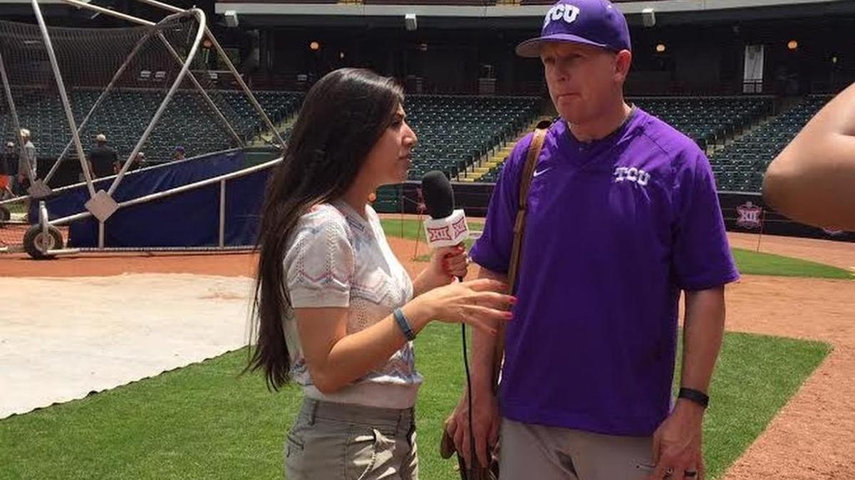 TCU coach Jim Schlossnagle speaks with a reporter after practice Tuesday at Chickasaw Bricktown Ballpark in Oklahoma City.