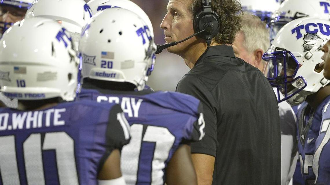 Co-offensive coordinator Doug Meacham talks to the players during the second half of TCU’s 2014 game against Samford, his first with the Horned Frogs.