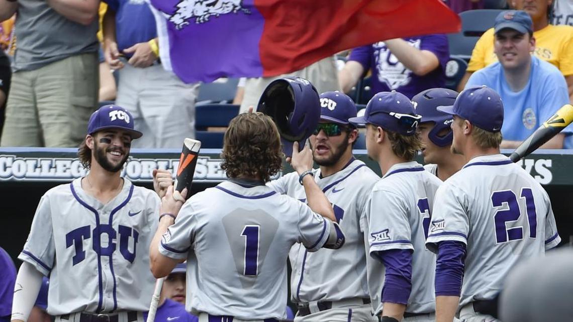 
TCU's Cody Jones (1) is greeted at the dugout after scoring a run on a single by Connor Wanhanen in the fourth inning of Sunday’s College World Series game against LSU. The win put the Horned Frogs in a winner’s bracket game Tuesday night against Vanderbilt.
