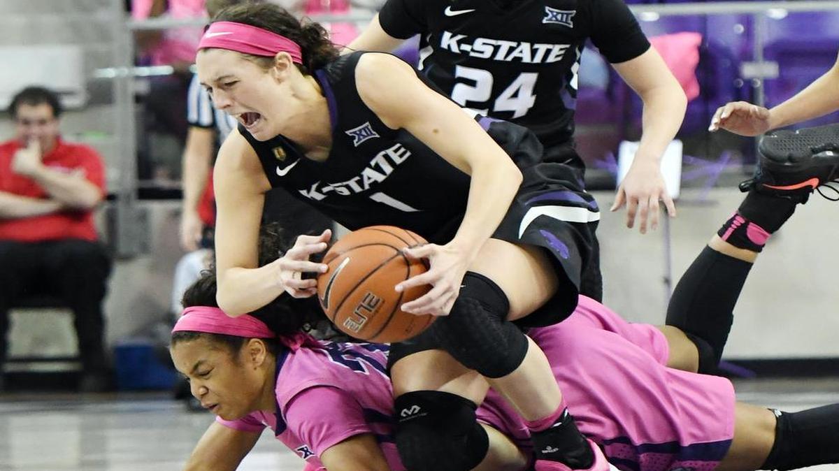 TCU’s AJ Alix, left falls on Kansas State’s Kaylee Page as she picks up a loose ball during the fourth quarter of Saturday’s February 18, 2017 basketball game at Schollmaier Arena, in Fort Worth, Texas. TCU fell to Kansas State 68-65.