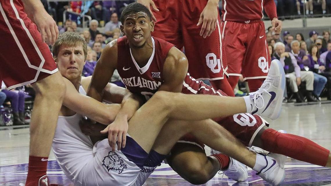 TCU forward Vladimir Brodziansky, left, and Oklahoma guard Christian James fight for a loose ball in the second half of Saturday’s Big 12 opener. Oklahoma beat TCU 90-89.
