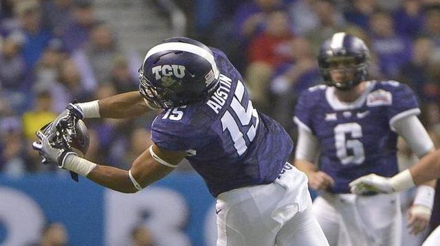 TCU quarterback Bram Kohlhausen connects with receiver Jaelan Austin during the first half Saturday night.