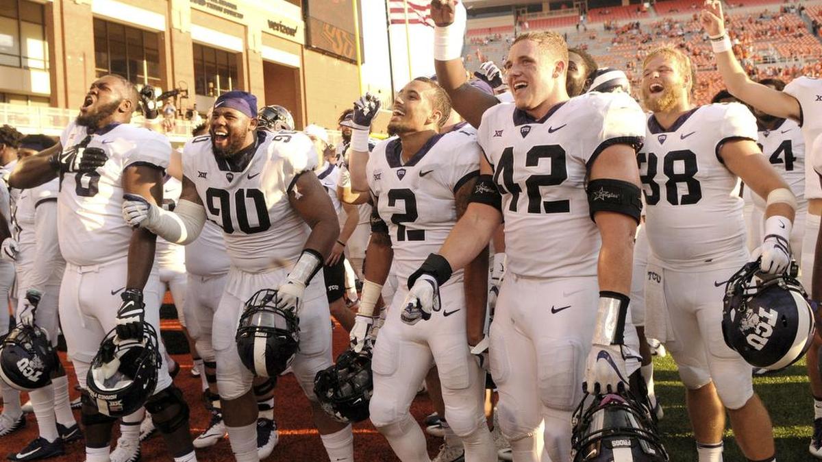 TCU players celebrate with fans in the end zone at Boone Pickens Stadium after a 44-31 victory against Oklahoma State on Saturday.