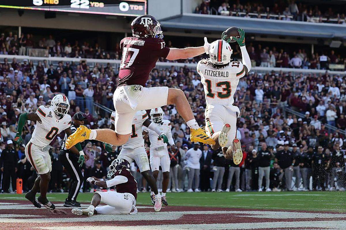 Miami defensive back Bryce Fitzgerald (13) intercepts a pass intended for Texas A&M tight end Theo Melin Ohrstrom in the final seconds of the College Football Playoff first-round game Saturday at Kyle Field in College Station.