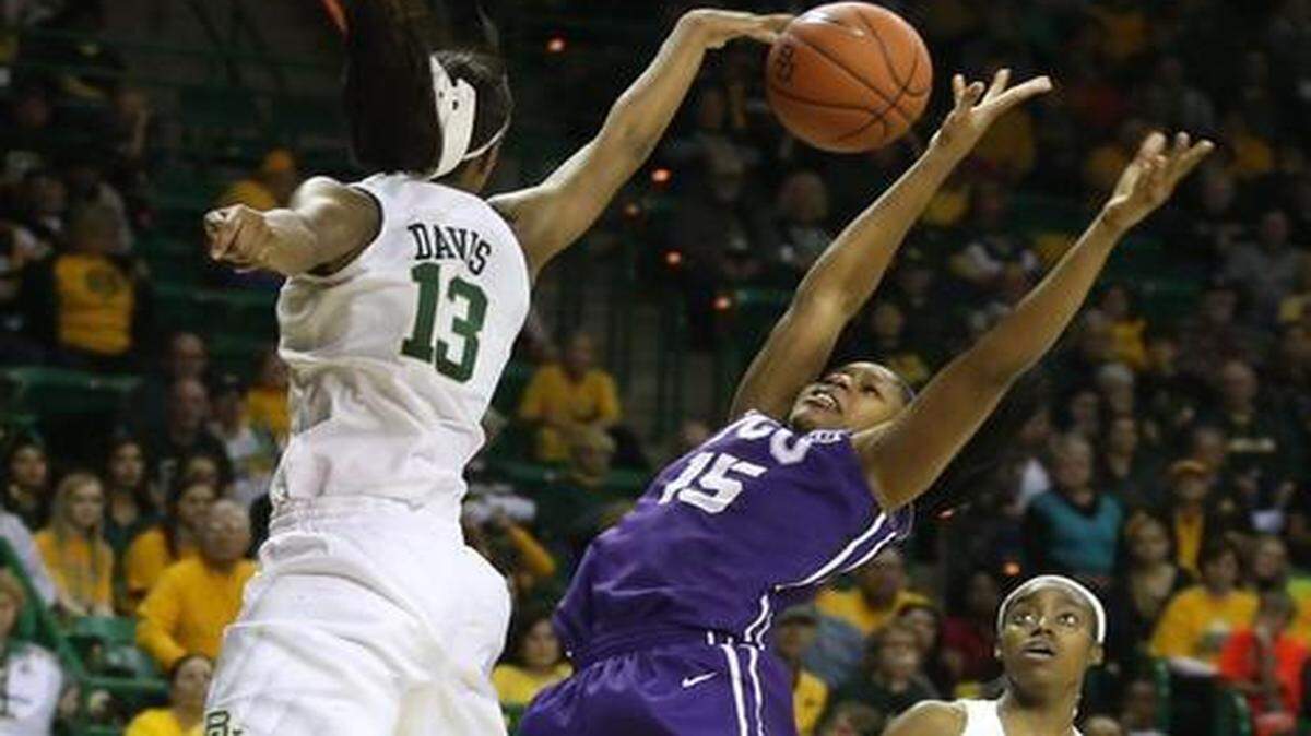 
Baylor forward Nina Davis (13) records one of her two blocks on a shot by TCU’s Jada Butts (15).
