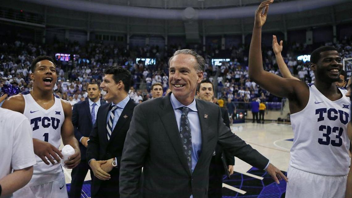 TCU coach Jamie Dixon celebrates with the players after the Horned Frogs defeated Richmond in the NIT quarterfinals on March 21.