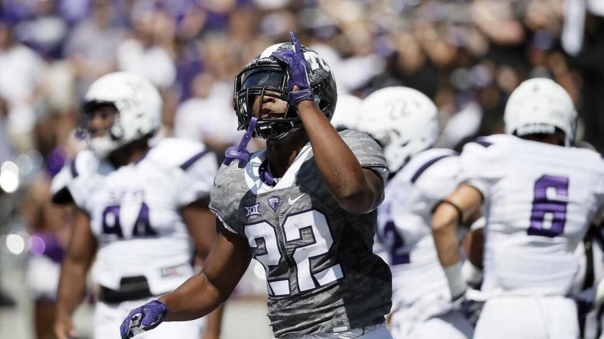 
TCU running back Aaron Green gestures after scoring in the first quarter against Stephen F. Austin. He had two touchdowns as TCU roared to a 35-0 lead.
