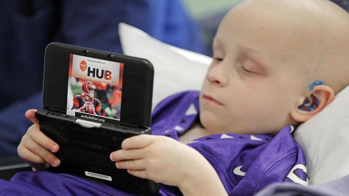Cancer patient Micah Ahern, shown in 2014 at age 4, visited the TCU baseball team on Tuesday in Omaha, Neb., and watched the Horned Frogs’ victory with his mother. Micah, now 7, has been close to the program since 2014.