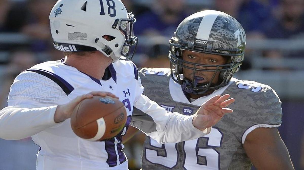 TCU defensive end Breylin Mitchell rushes against Stephen F. Austin quarterback Hunter Taylor in a 2015 game at Amon G. Carter Stadium. Mitchell, who left the Horned Frogs in midseason this year, is charged with robbery causing bodily injury from a Nov. 25 incident in Round Rock.