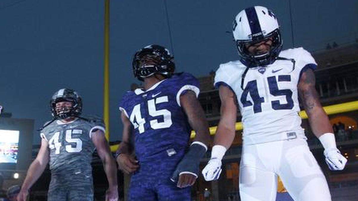 
Colin Jones, left, Trevone Boykin, cneter, and Josh Doctson take the stage Friday as TCU unveils its new uniforms for next season.
