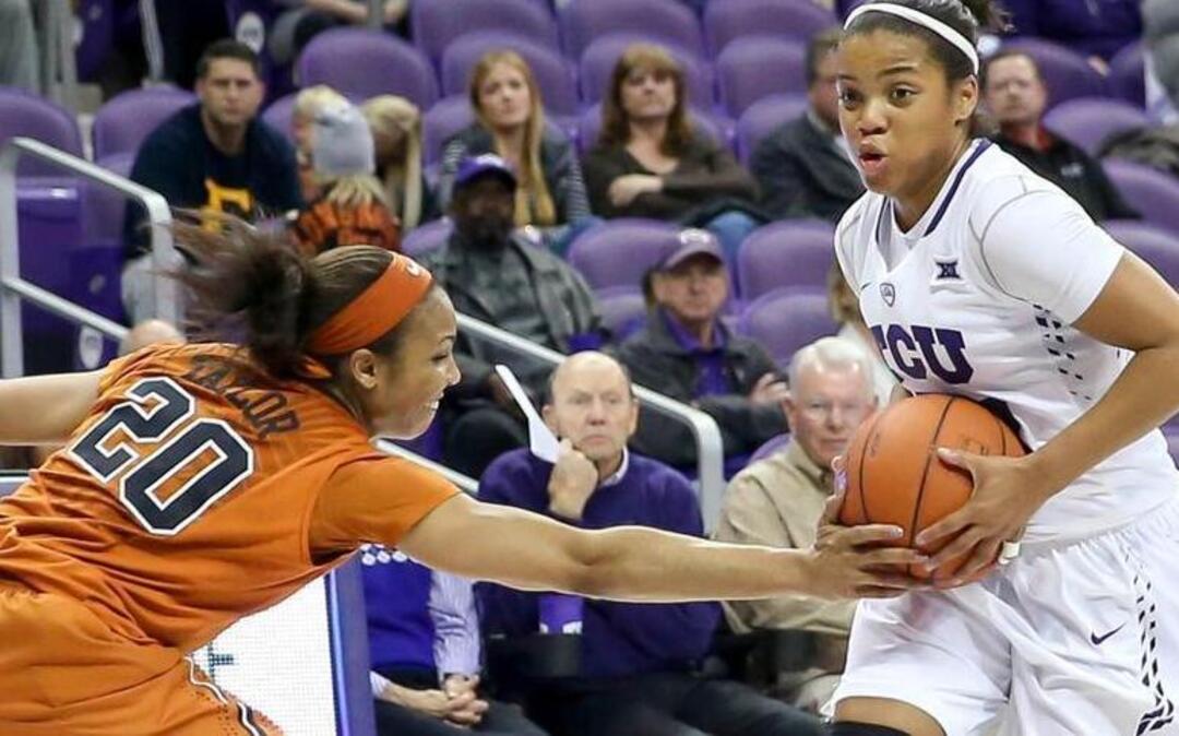 TCU guard A.J.Alix (23) tries to get past Texas guard Brianna Taylor (20) during the third quarter Wednesday night at Schollmaier Arena.