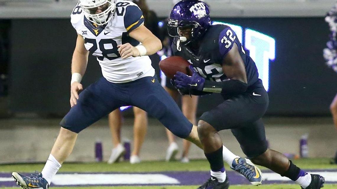 TCU linebacker Travin Howard intercepts a pass intended for West Virginia tight end Elijah Wellman in the fourth quarter of a game last season at Amon G. Carter Stadium. Howard was the Horned Frogs’ leading tackler a year ago.